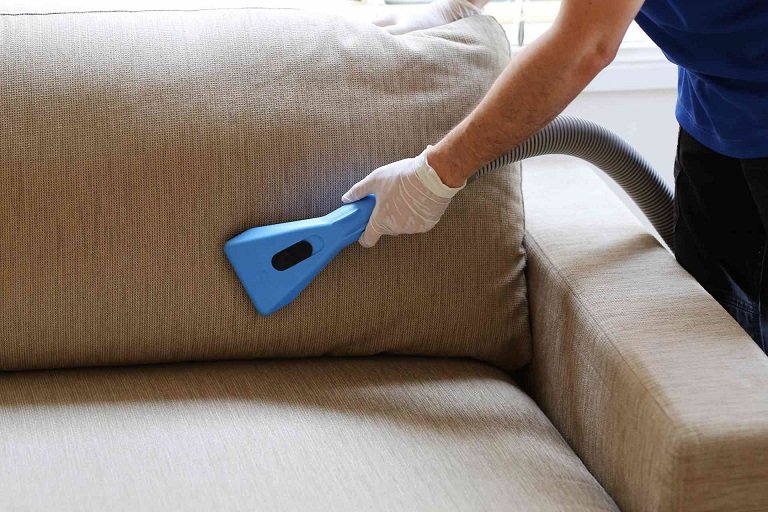 upholstery cleaner worker removing stains